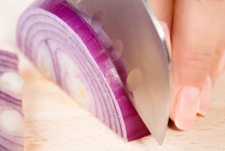 Woman cutting onions