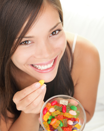 Woman eating gummy bears
