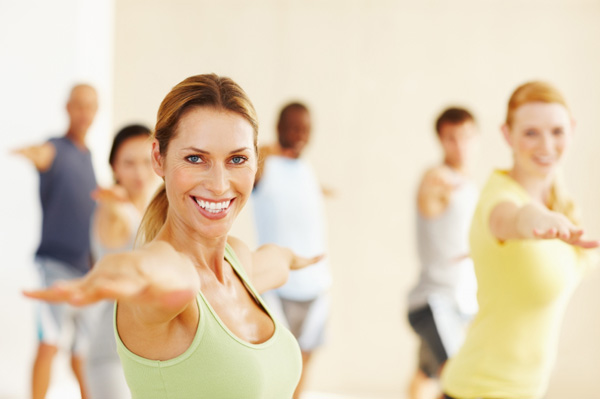 Woman leading yoga class