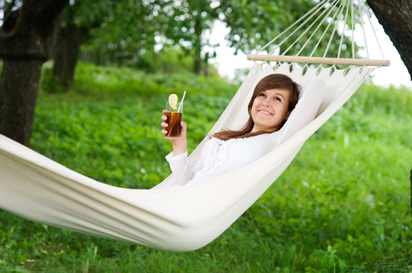 Woman relaxing in hammock