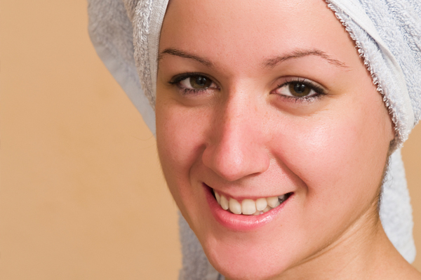 woman towel drying hair