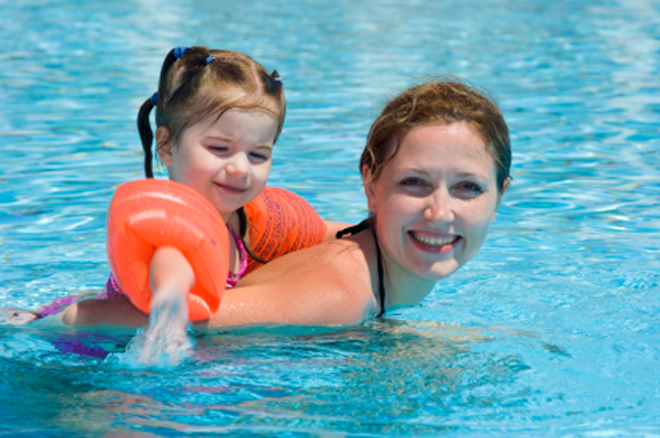 baby and mom at resort swimming
