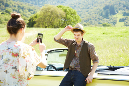 Couple on road trip in fall stopping to take photo