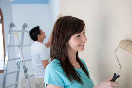 Couple painting wall