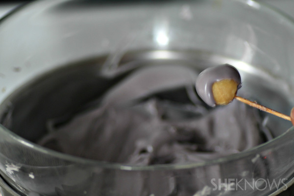Dip each nut to form helmet shape