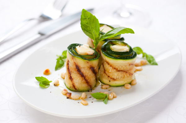 Grilled zucchini roll-ups with herbs and goat cheese