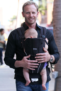 Ian Ziering carries his newborn daughter Mia Loren