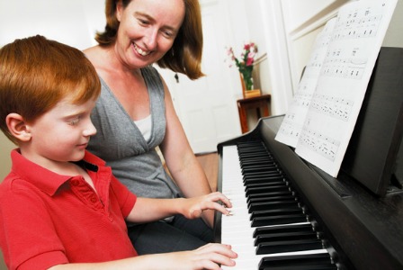 Boy taking piano lessons