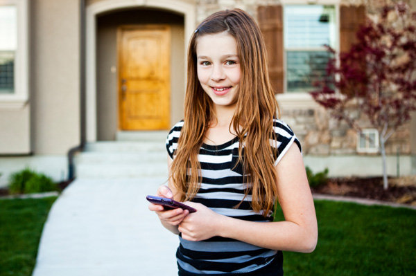 middle school girl using cellphone