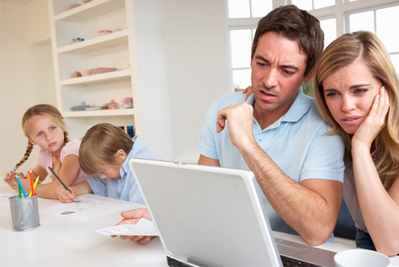 Mom and dad looking at children's grades online