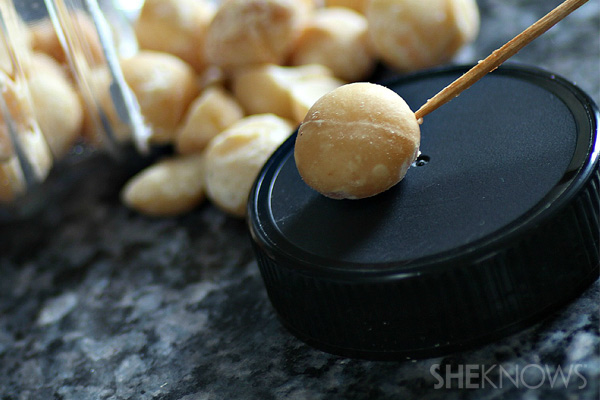 Stick each nut onto a toothpick