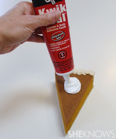 Add dollop of white caulking to the top of the pie