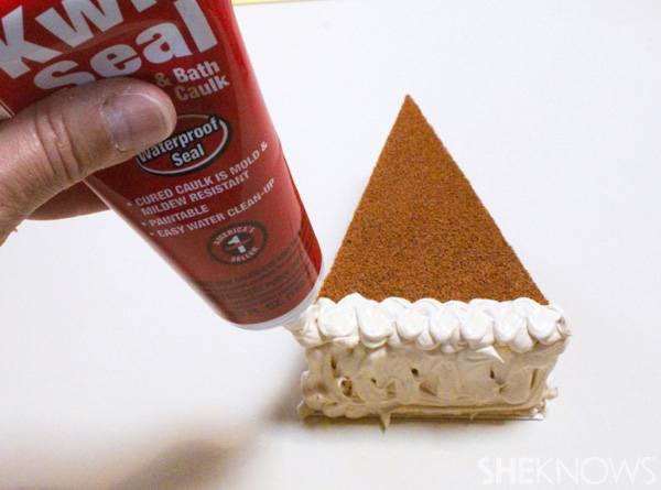 Adding the caulk to the back of the pie for the crust 