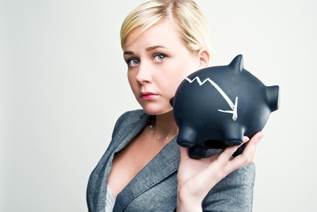 sad woman with piggy bank