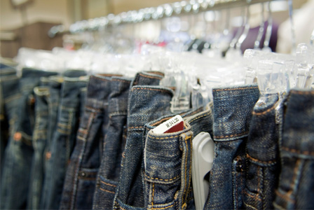 Variety of jeans on hangers