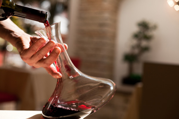 Wine being poured into decanter