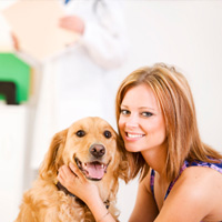 Woman with dog at vet