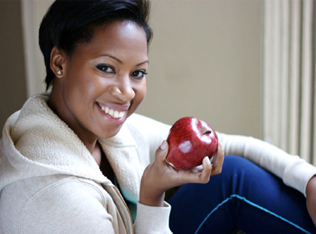 Woman eating an apple