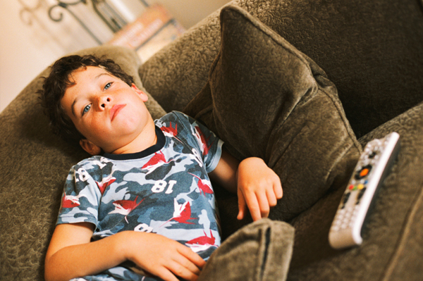 boy bored on couch