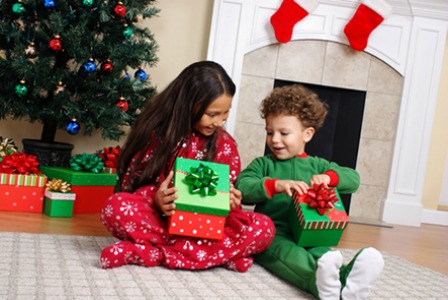 Kids opening Christmas gifts