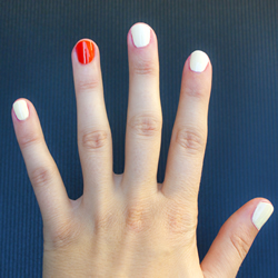 White finger nails, with an orange ring fingertip