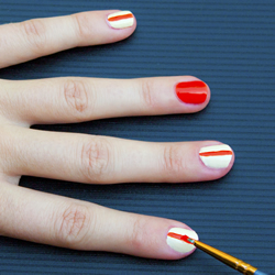 Creating the orange stripe on the white finger nails