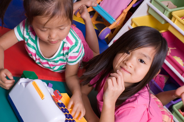 Little grls playing with cash register