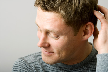 Man scratching his head