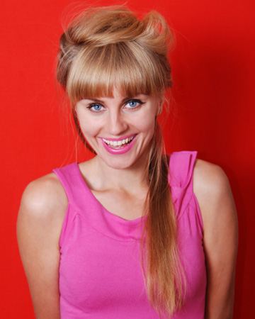 Woman wearing bright pink lipstick for the holidays
