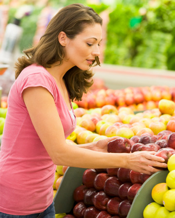 Woman shopping for apples