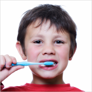 Kid brushing his teeth