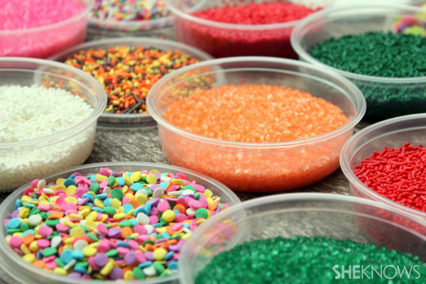 use sprinkles and candies to decorate cookies