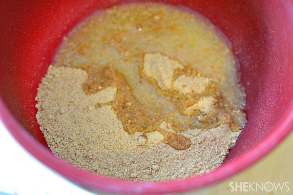 Graham cracker crumbs and butter in mixing bowl