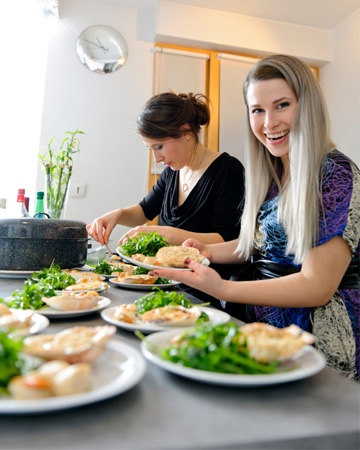 Girlfriends cooking dinner