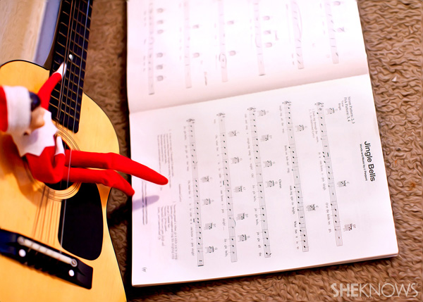 Elf on the Shelf idea 6: Elfie Rojo playing music