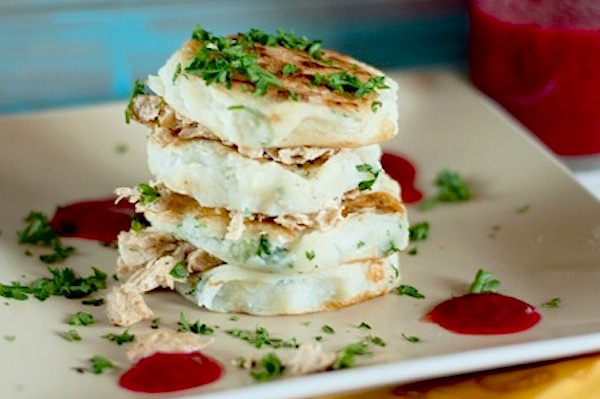 Mashed potato pancakes with turkey and cranberry syrup