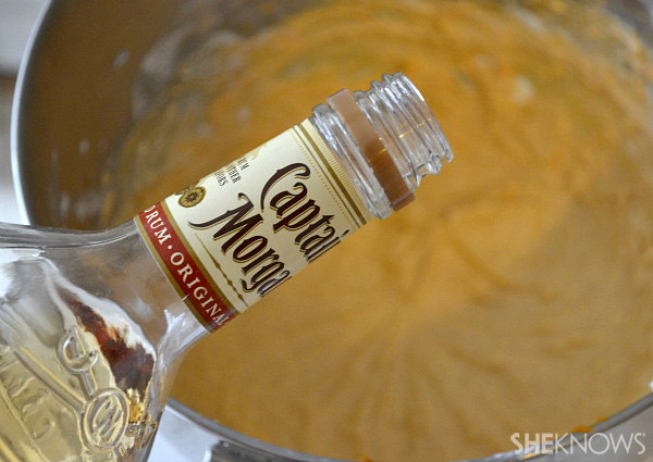Adding rum to the mixture