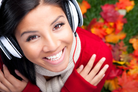 Woman listening to music in autumn