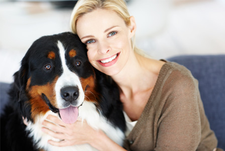 Woman hugging dog