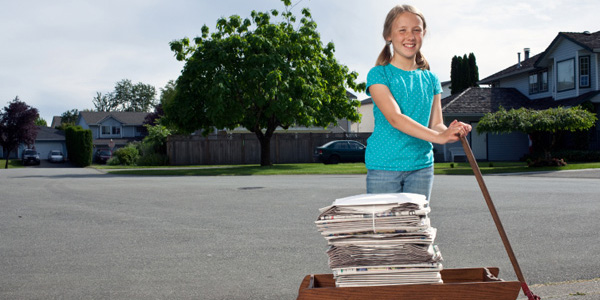 Girl delivering newspapers