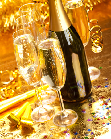 Champagne flute glasses with bottle on New Years Eve