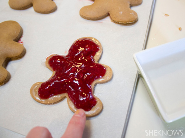 Cherry-filled gingerbread man tarts -- wet edges with water