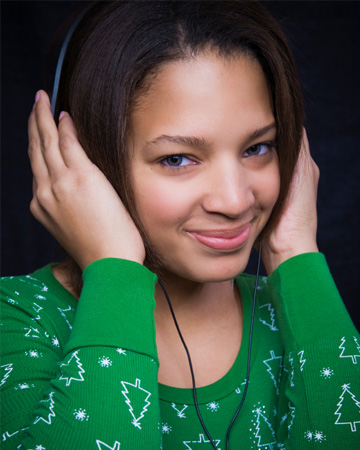 Festive woman listening to Christmas music