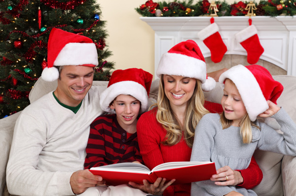 Family reading Christmas memory book