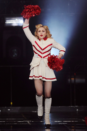 Madonna onstage as a cheerleader