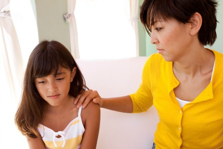 Mother talking to daughter