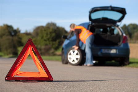 Woman changing tire