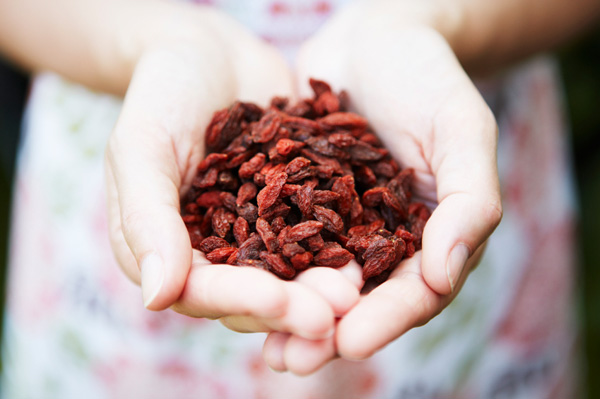 Woman holding goji berries
