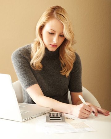 Woman paying bills at home