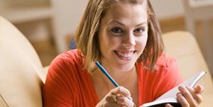 woman writing in notebook